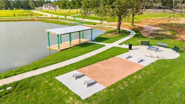 a living room with fireplace furniture and a large window