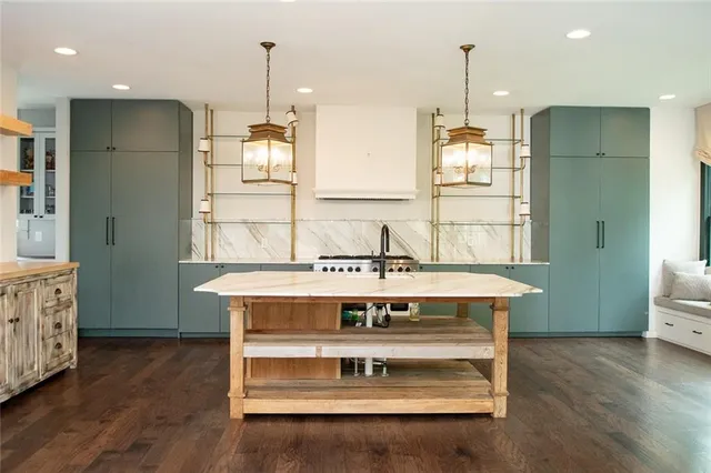 a view of a porch with wooden floor and outdoor space