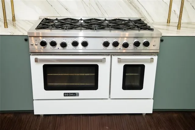 a bedroom with a bed and chandelier