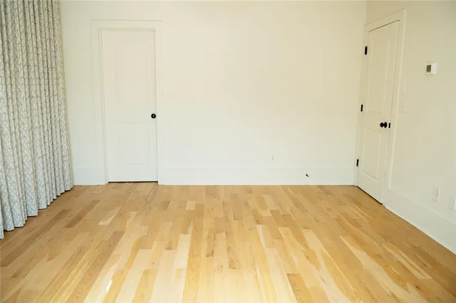 a kitchen with a refrigerator and a stove top oven