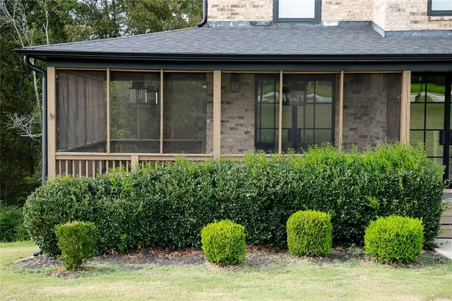 a view of a porch with a floor to ceiling window