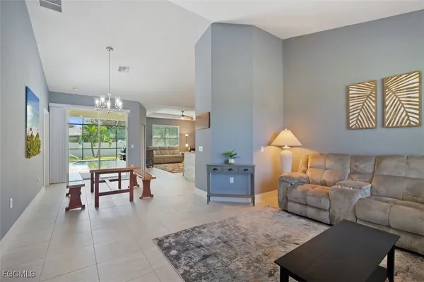 a living room with furniture and a table