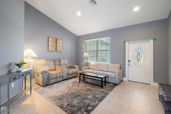 a living room with furniture and a window