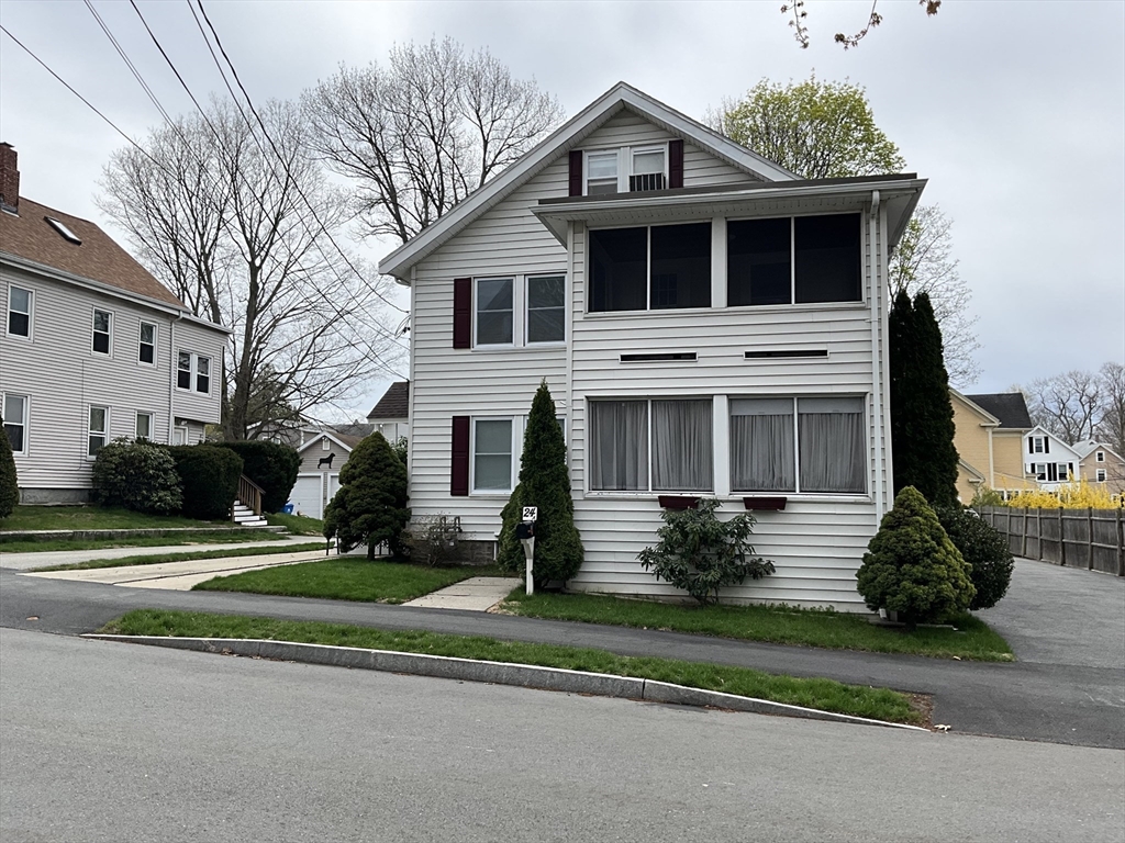 24 Pearl Street, Unit 2 Wakefield, MA 01880 - Photo 15 of 15 a view of a house with a yard