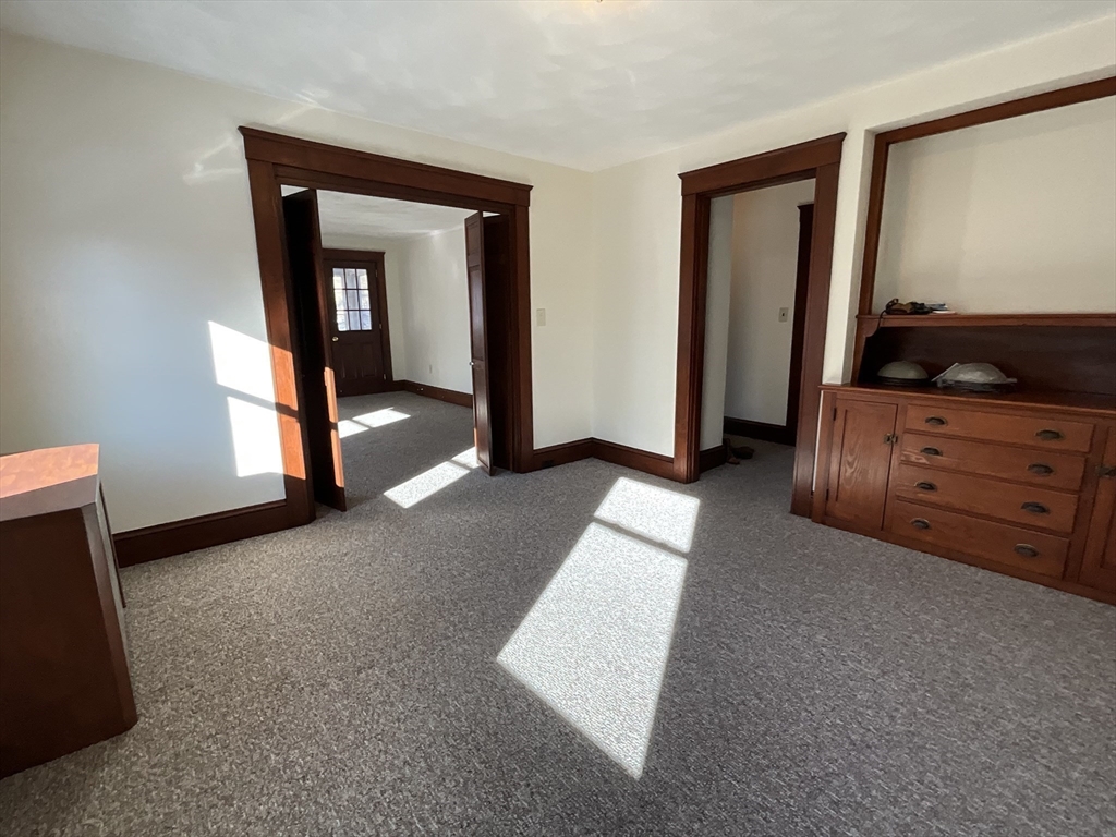24 Pearl Street, Unit 2 Wakefield, MA 01880 - Photo 6 of 15 a view of an empty room and window