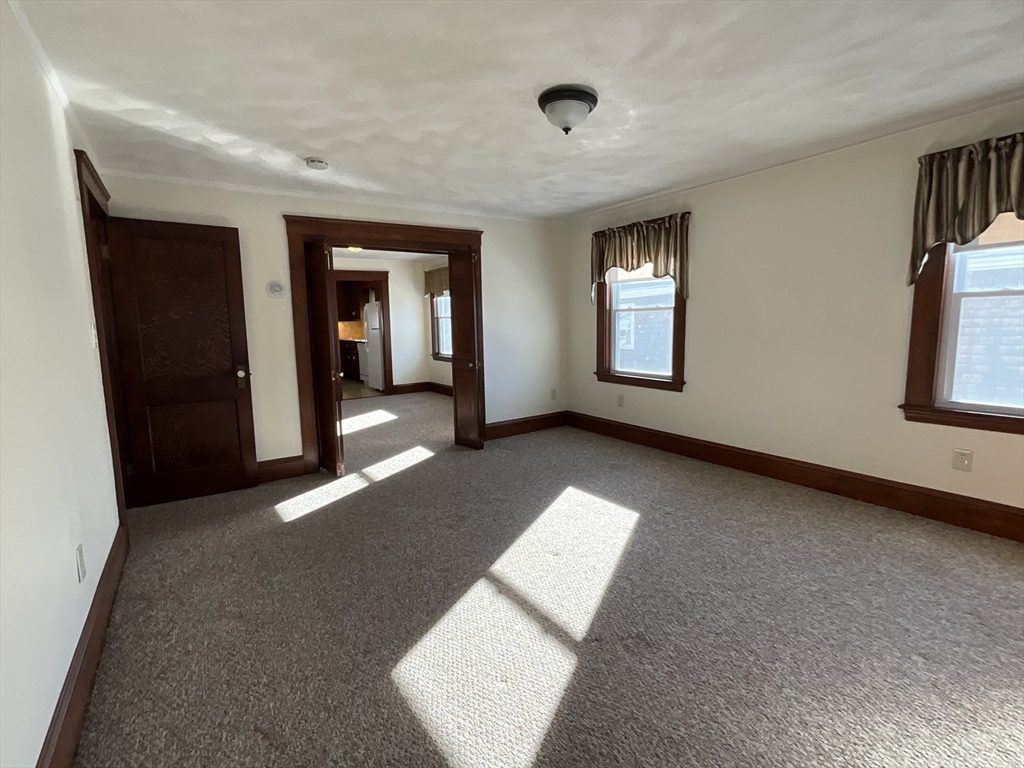 24 Pearl Street, Unit 2 Wakefield, MA 01880 - Photo 7 of 15 a view of livingroom with window