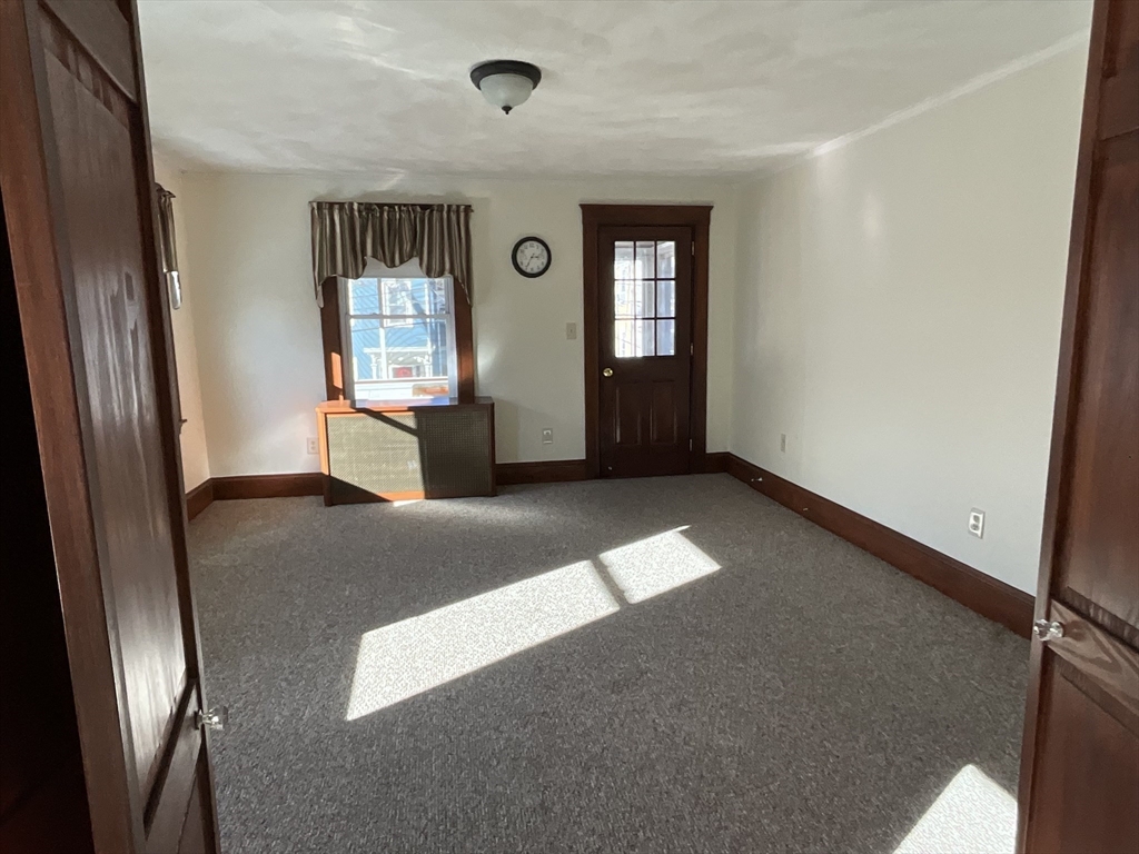 24 Pearl Street, Unit 2 Wakefield, MA 01880 - Photo 8 of 15 a view of livingroom with window