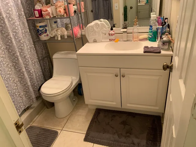 an empty room with wooden floor and a window