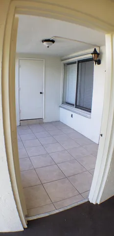 a view of a closet area with mirror