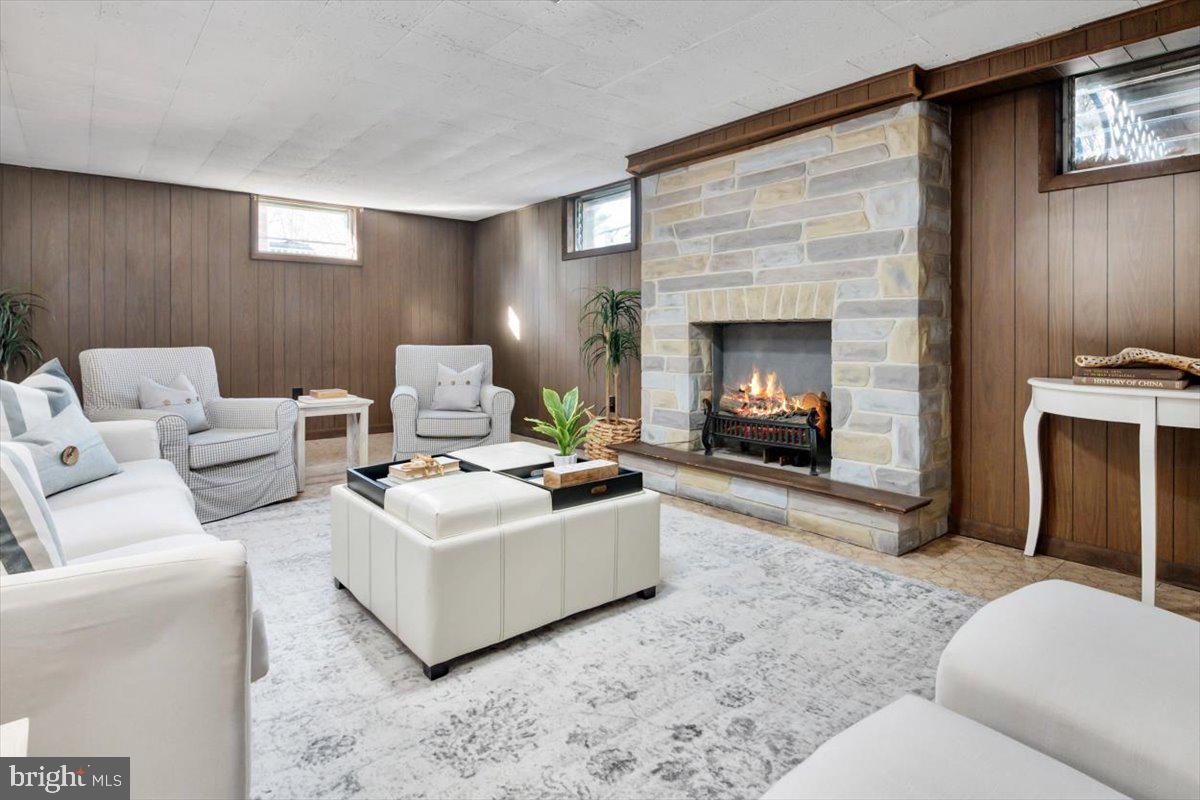 36 Carroll Road Pasadena, MD 21122 - Photo 23 of 37 a living room with furniture and a fireplace