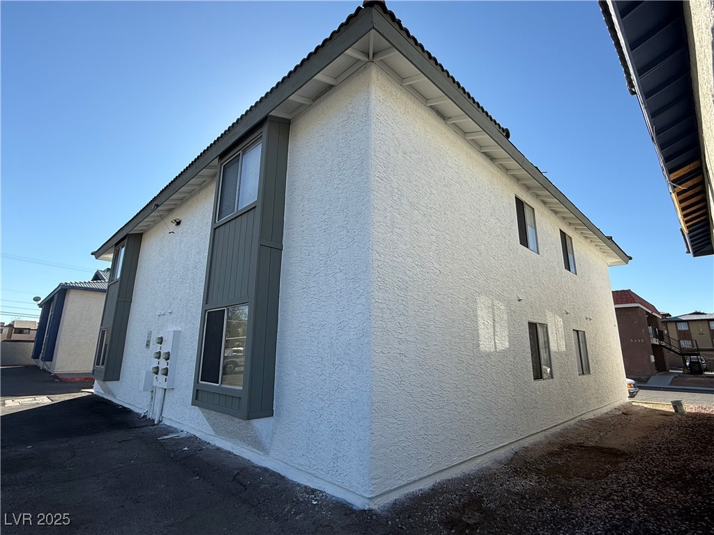 5336 Mancos Court, Unit 2 Las Vegas, NV 89119 - Photo 30 of 31 View of home's exterior with stucco siding