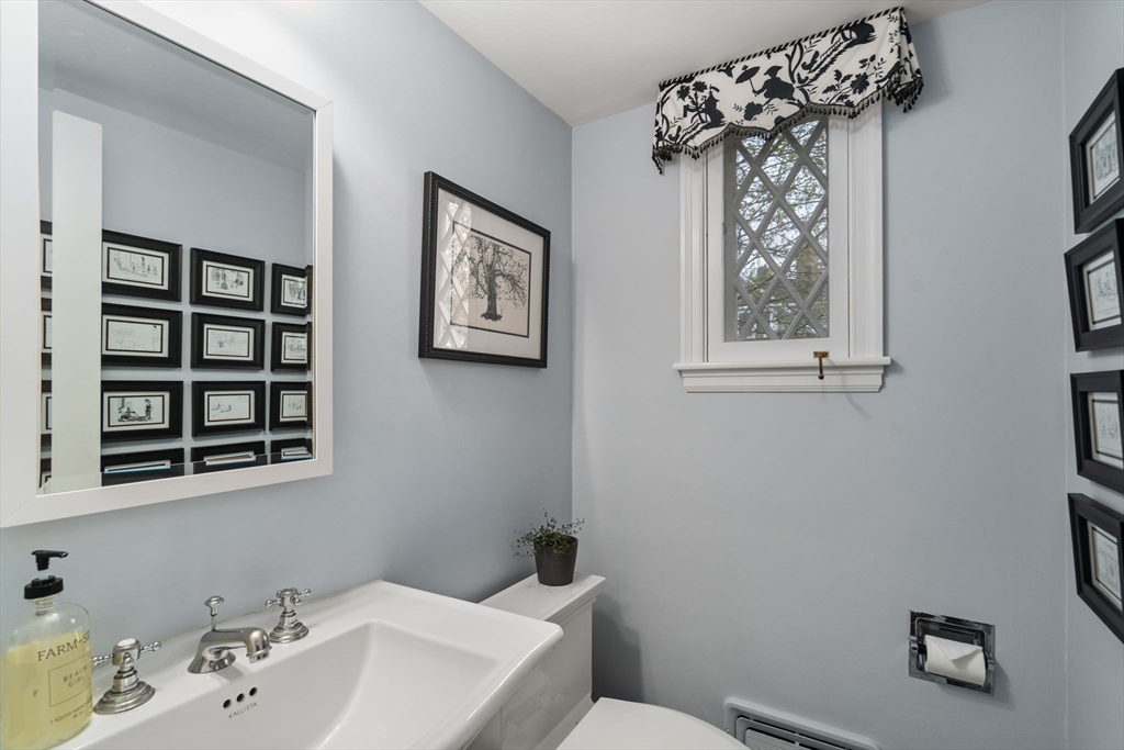 37 Oakridge Road Wellesley, MA 02481 - Photo 18 of 39 a bathroom with a sink mirror and toilet