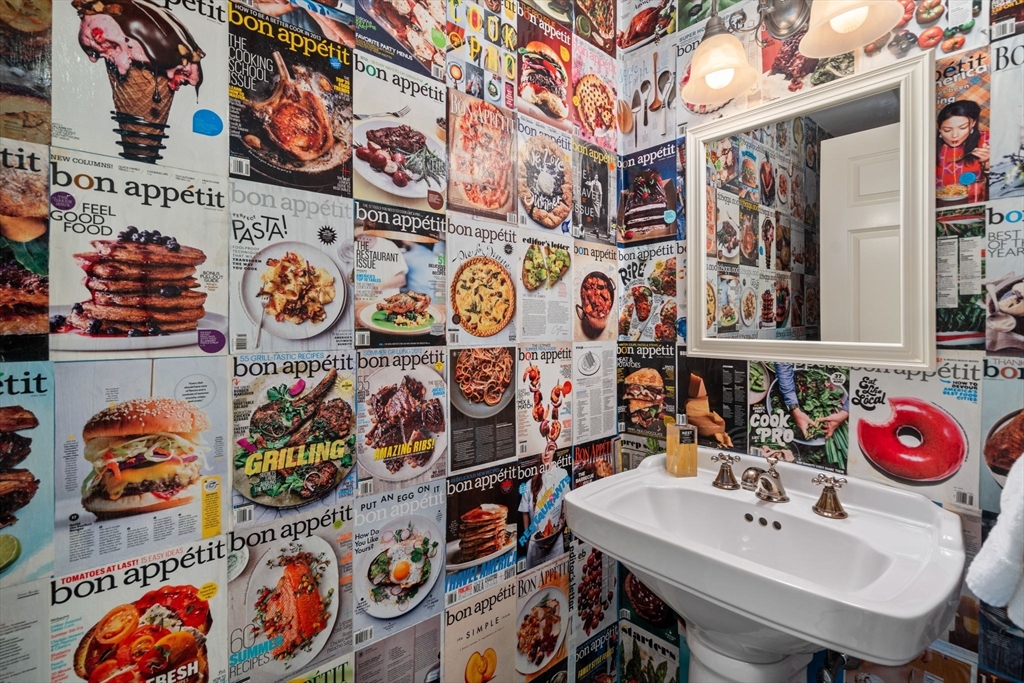 37 Oakridge Road Wellesley, MA 02481 - Photo 20 of 39 a bathroom with a sink and lots of painting on the wall