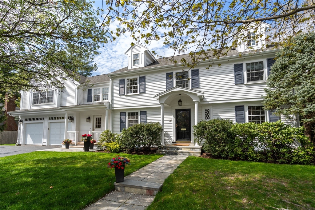 37 Oakridge Road Wellesley, MA 02481 - Photo 2 of 39 a front view of a house with a yard and trees