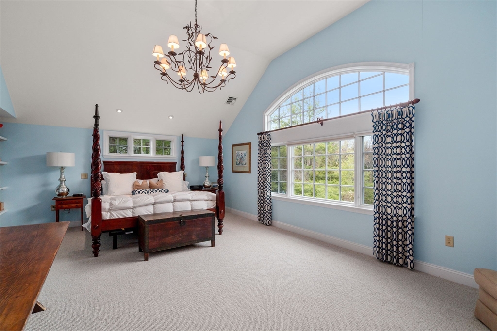 37 Oakridge Road Wellesley, MA 02481 - Photo 21 of 39 a bed room with a bed and a chandelier