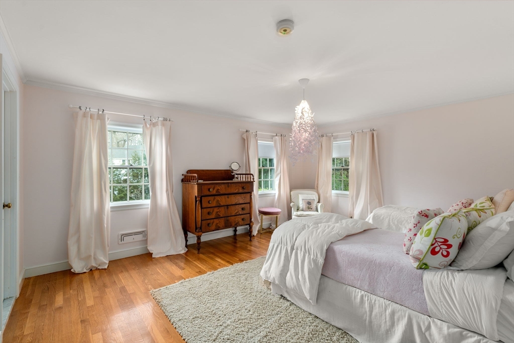 37 Oakridge Road Wellesley, MA 02481 - Photo 25 of 39 a bedroom with a bed closet and a large window