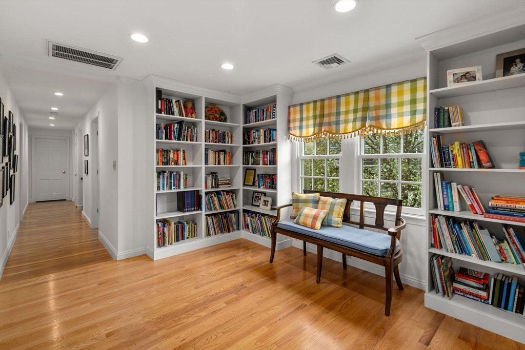 37 Oakridge Road Wellesley, MA 02481 - Photo 32 of 39 a living room with furniture and a book shelf