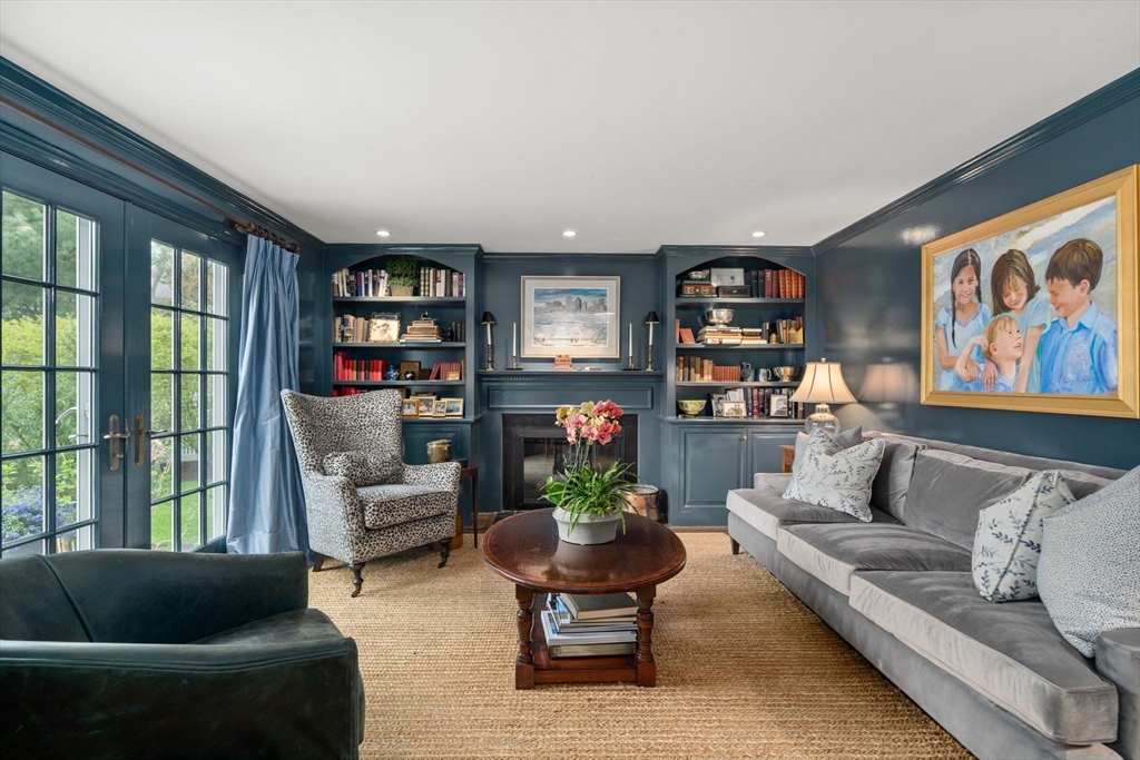 37 Oakridge Road Wellesley, MA 02481 - Photo 4 of 39 a living room with furniture a bookshelf and a large window