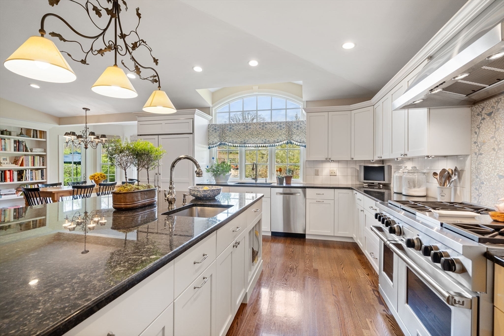 37 Oakridge Road Wellesley, MA 02481 - Photo 9 of 39 a kitchen with stainless steel appliances granite countertop a sink a stove and a wooden floors