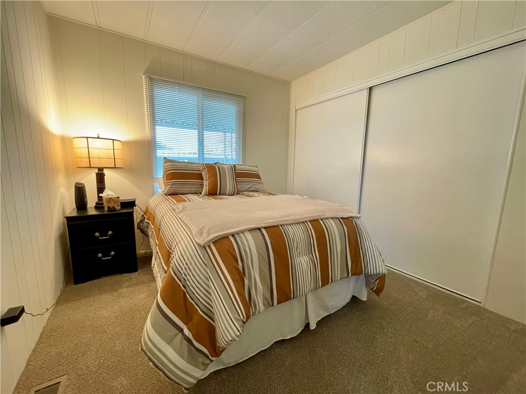 31130 South General Kearny Road, Unit 145 Temecula, CA 92591 - Photo 2 of 27 a bed room with a bed and a window