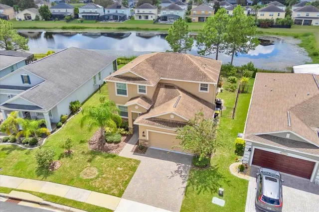 an aerial view of a house with a garden