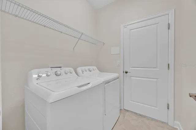 a view of an empty room with stairs