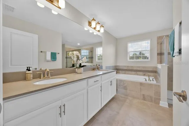 a bath tub sitting next to a shower
