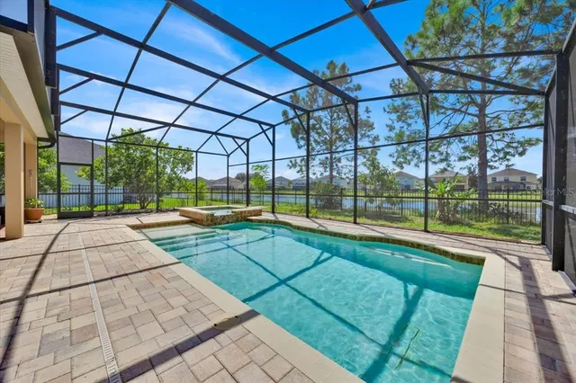 a view of a swimming pool with a patio