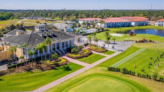 a view of a big room with wooden floor and windows