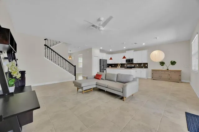 a kitchen with cabinets and stainless steel appliances