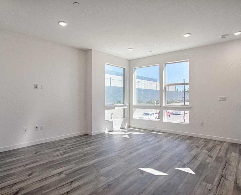 6705 Optimum Loop San Jose, CA 95119 - Photo 12 of 19 a view of an empty room with wooden floor and a window