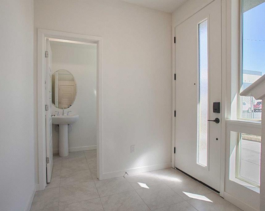 6705 Optimum Loop San Jose, CA 95119 - Photo 5 of 19 a view of a hallway with front door and a door