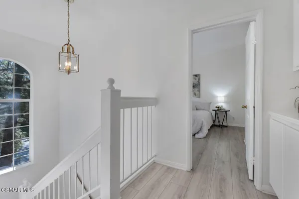a view of a bedroom from a hallway