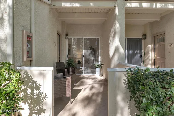 a front view of a house with a fountain