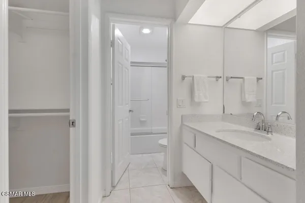 a bathroom with a shower and a toilet