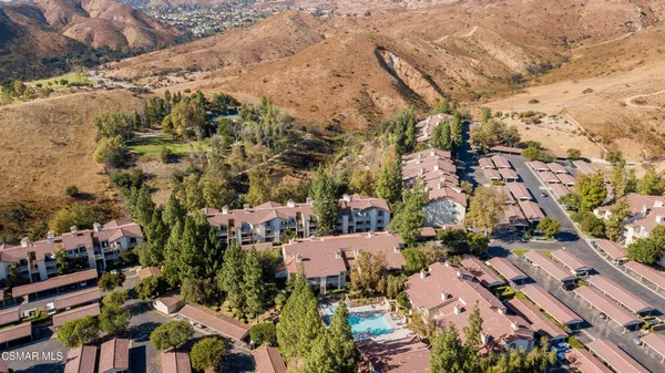 an aerial view of residential houses with outdoor space