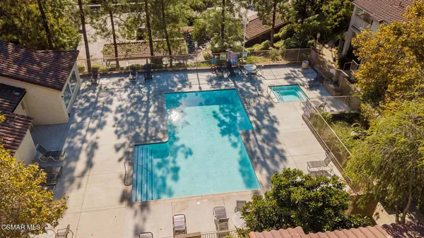 swimming pool view with a outdoor seating