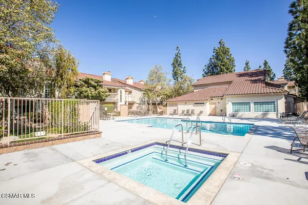 a view of a swimming pool with a lounge chairs