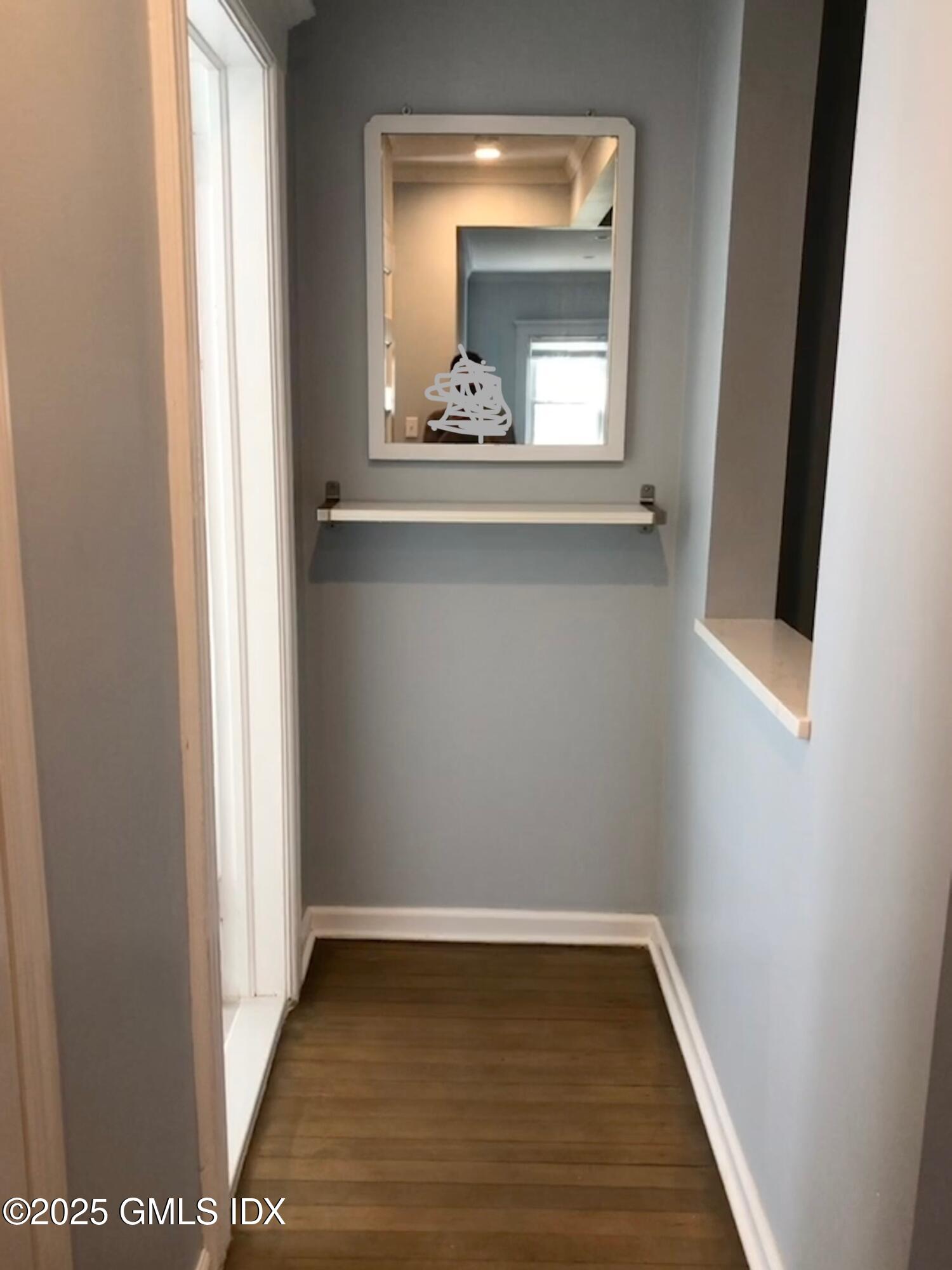 32 Ridge Street, Unit 2 Greenwich, CT 06830 - Photo 3 of 19 a view of a small space with wooden floor and a window