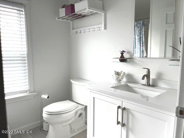32 Ridge Street, Unit 2 Greenwich, CT 06830 - Photo 8 of 19 a white toilet sitting next to a bathroom sink