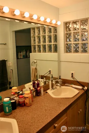 a bathroom with a sink and a mirror