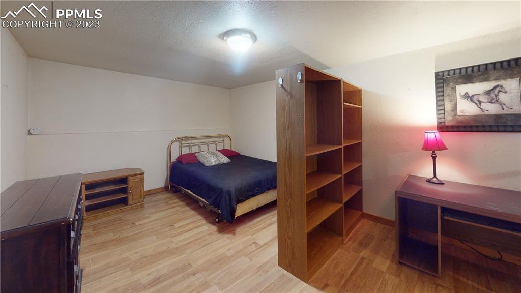 1011 Castle Ridge View Cripple Creek, CO 80813 - Photo 34 of 48 a view of a room with wooden floor and closet