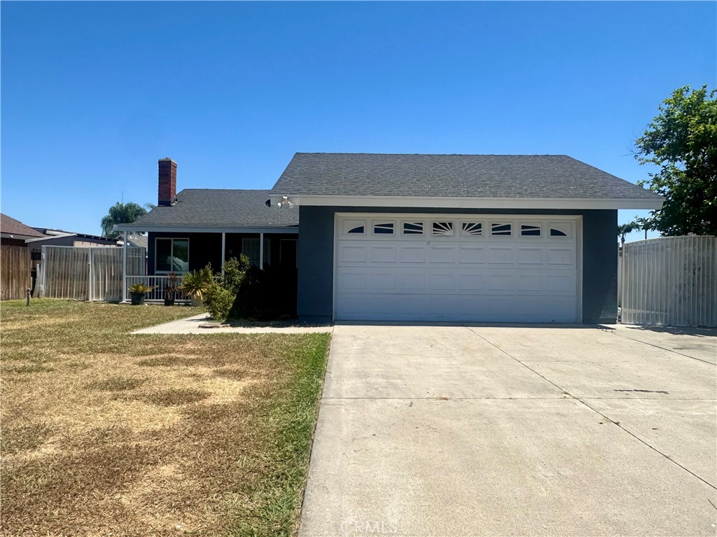 4233 Redstar Court Riverside, CA 92505 - Photo 1 of 1 a front view of a house with a yard