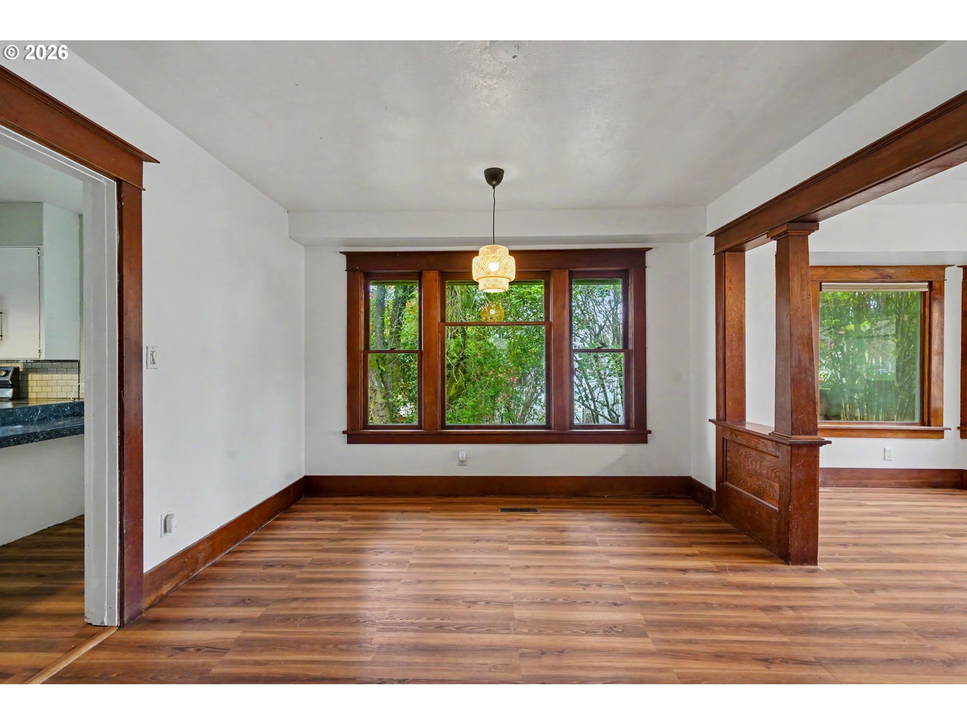 301 Orchard Street Silverton, OR 97381 - Photo 13 of 42 a view of an empty room with wooden floor and a window