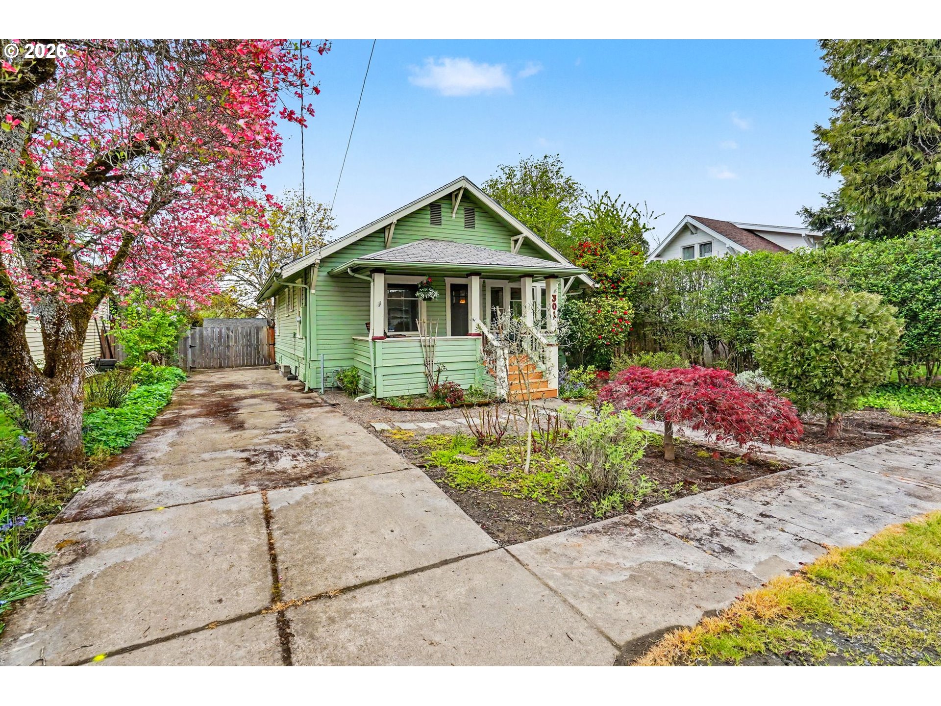 301 Orchard Street Silverton, OR 97381 - Photo 3 of 42 a house view with a garden space