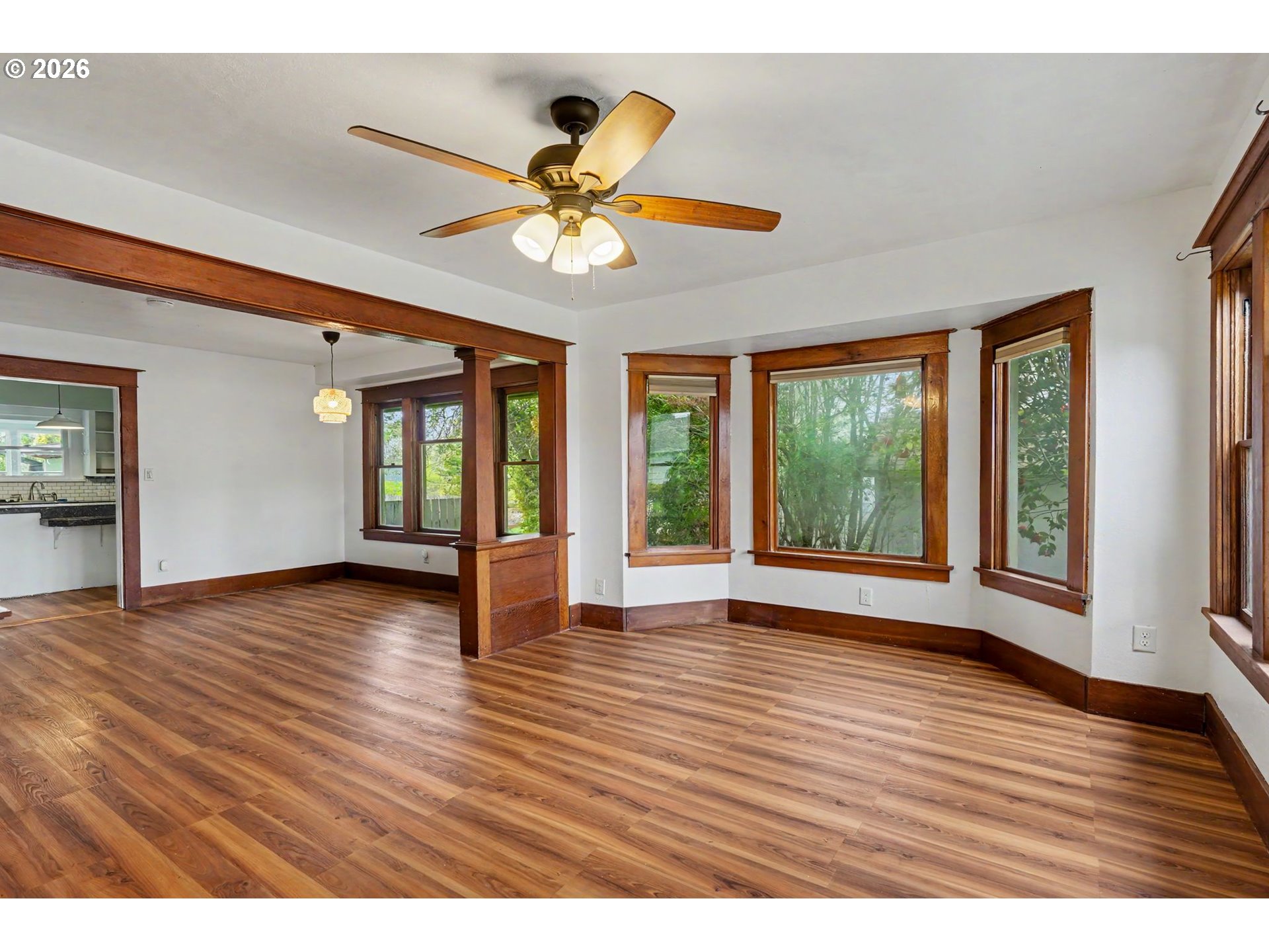 301 Orchard Street Silverton, OR 97381 - Photo 7 of 42 a view of an empty room with window and wooden floor