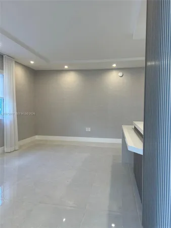 a kitchen with a stove and a refrigerator