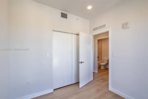 a view of a hallway with a room