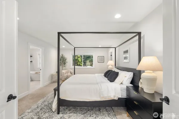 a bedroom with a bed and window