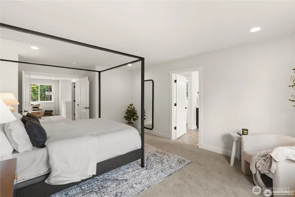 a bedroom with a bed and a couch